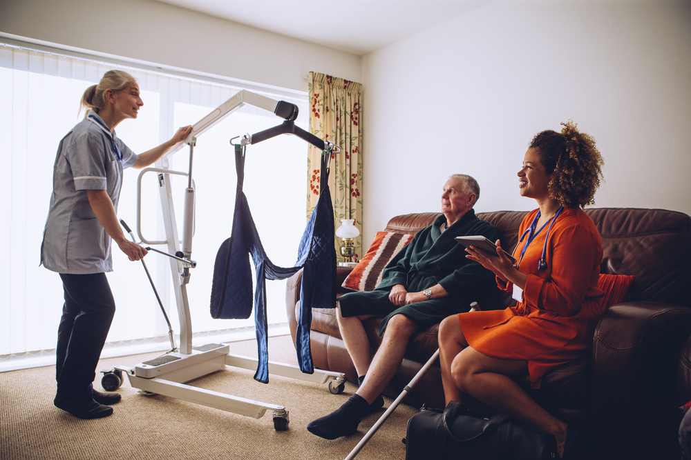 Nurse showing a family a DME item in their home.